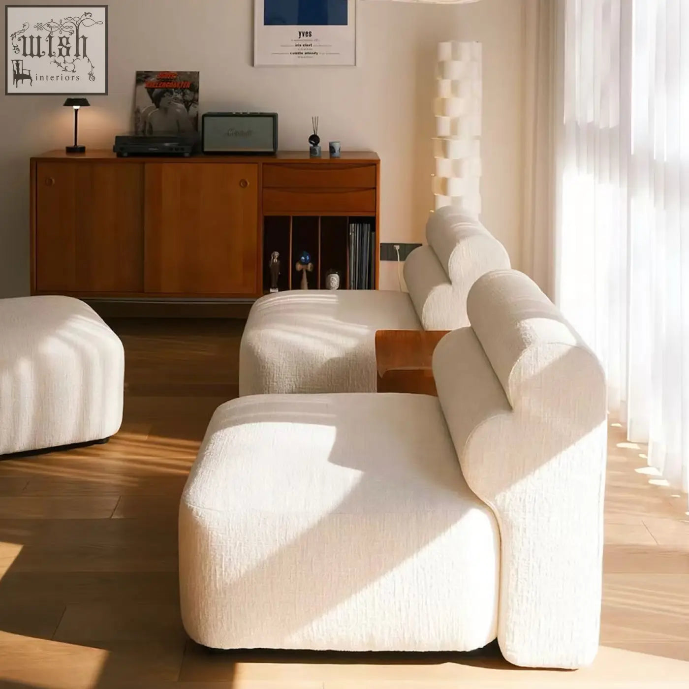 Cream-colored plush three seater corner sofa with velvet textured fabric and modern clean lines modular design