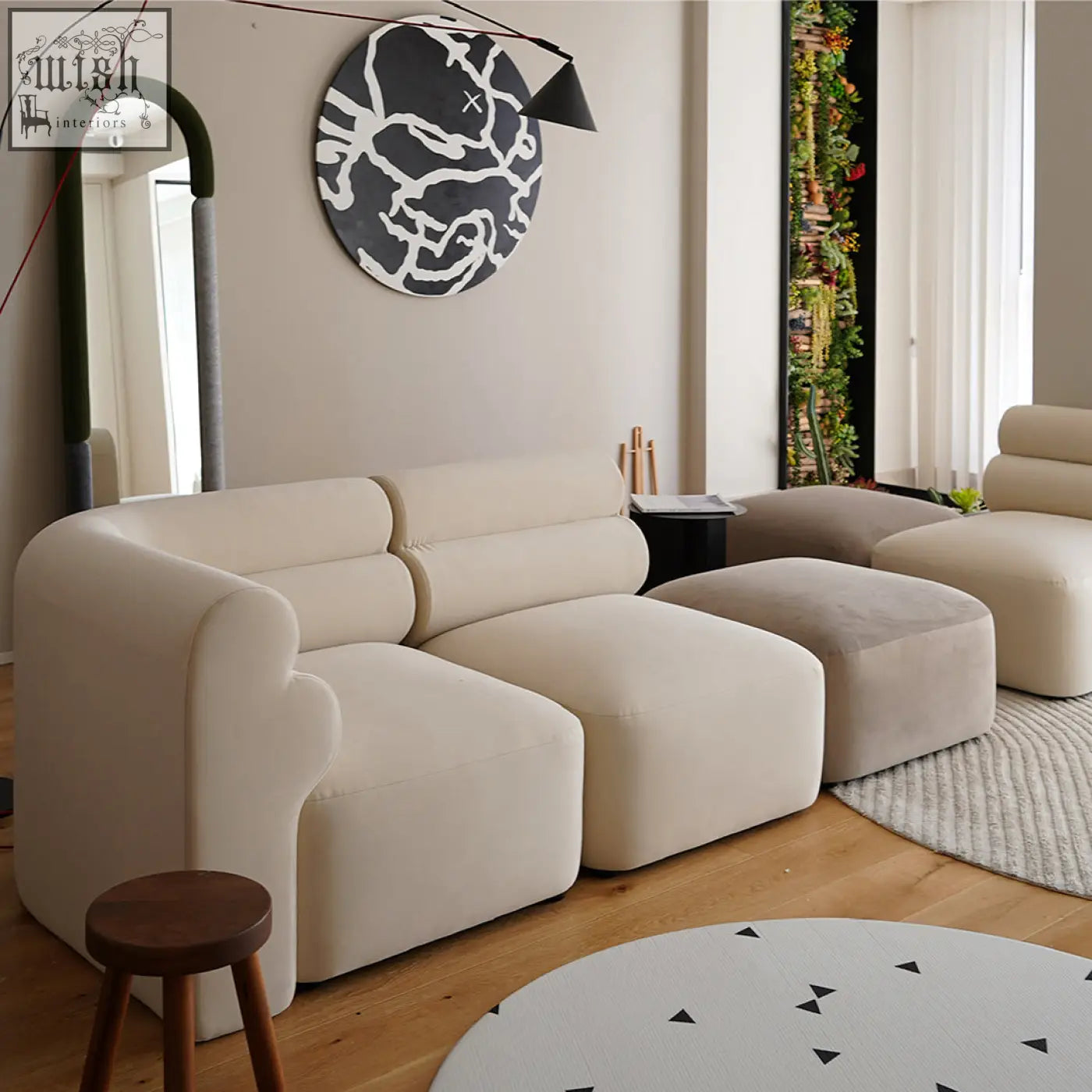 Cream-colored three seater corner sofa with plush rounded cushions and soft velvet fabric finish modular design