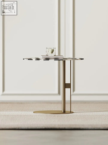 Bagley coffee table with a circular glass top featuring black and white geometric patterns and a gold stainless steel base