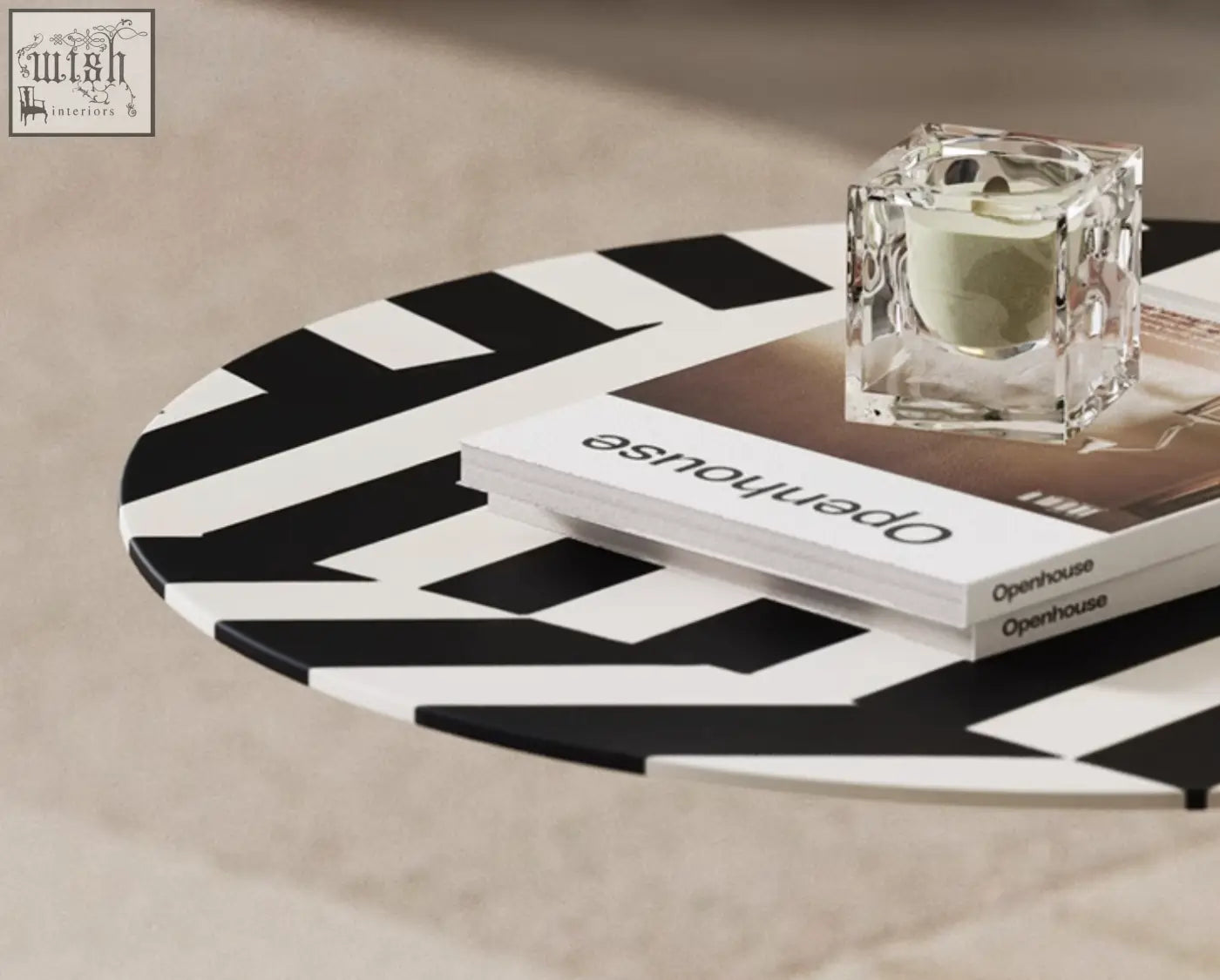 A sleek bagley coffee table with a bold black and white geometric pattern and stainless steel frame perfect for modern spaces