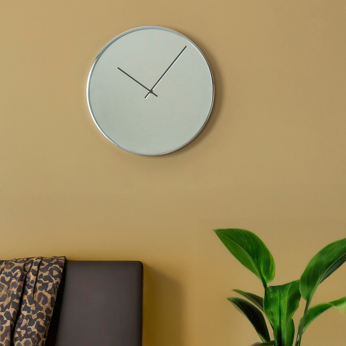 Bailie chrome and mirror wall clock with silver frame and white face featuring slender black hands for mirror wall use