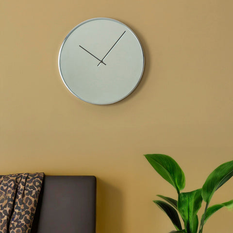 Bailie chrome and mirror wall clock with silver frame and white face featuring slender black hands for mirror wall use