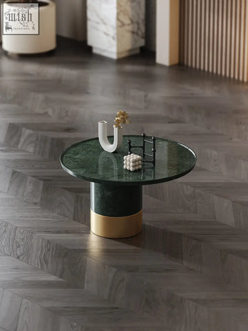 Dark green marble coffee table with cylindrical base and gold-toned bands from bain coffee table set