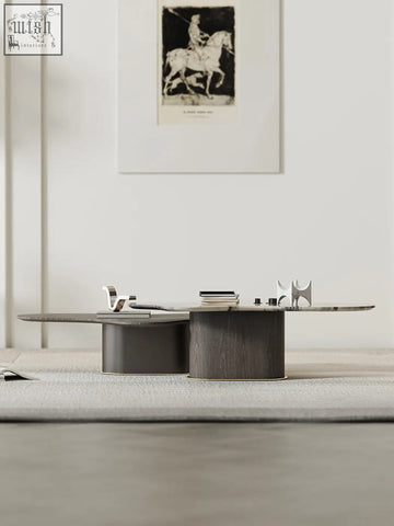 Modern baines marble coffee table with a dark matte wooden base and sleek elongated marble top