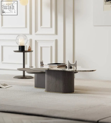 Modern oval baines marble coffee table with dark wood grain base and sleek reflective glass top perfect for living rooms