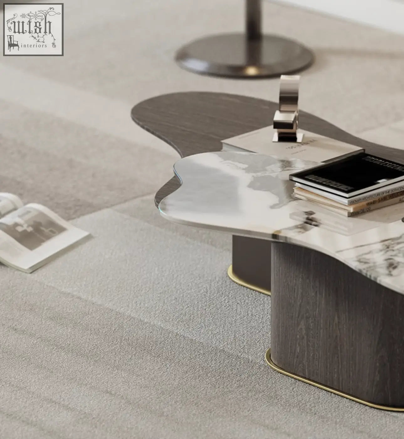 Modern baines marble coffee table with polished marble top dark wood base and gold trim in a sleek organic shape