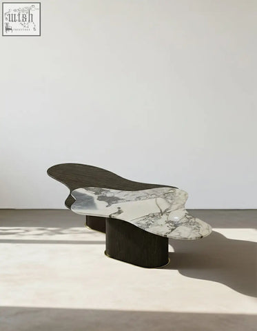 Organic-shaped baines marble coffee table with white marble top and dark wood legs perfect for stylish living rooms