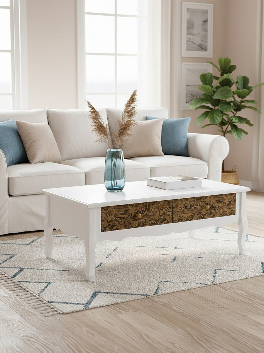 White bali coffee table with ornate wooden drawer fronts and delicate legs perfect for living room decor