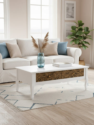 White bali coffee table with ornate wooden drawer fronts and delicate legs perfect for living room decor