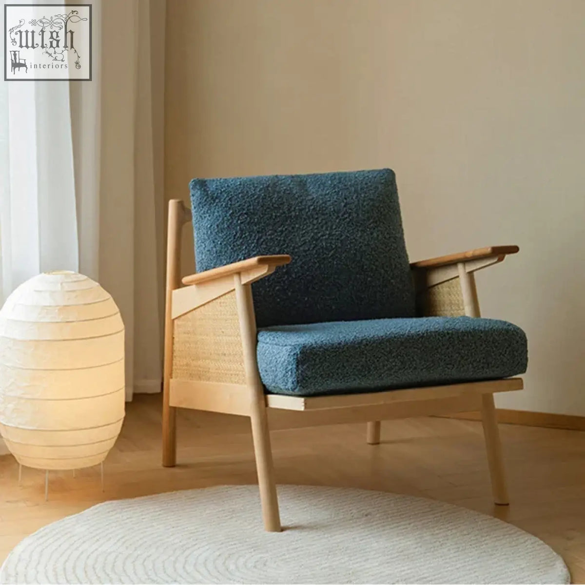 Balino chair with teal textured fabric seat and woven rattan accents on a light exposed wood frame armchair