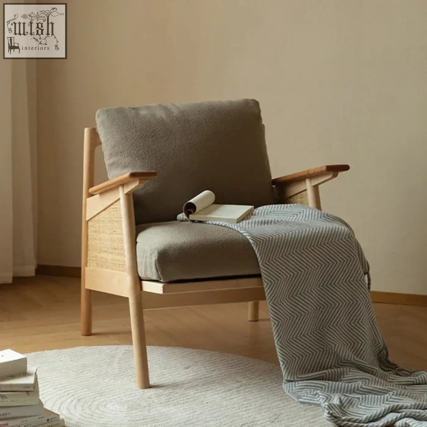 Balino chair with soft gray cushions and woven cane backrest on a light natural exposed wood frame