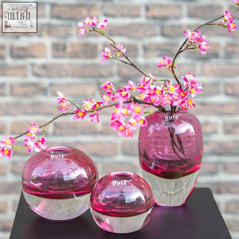 Set of three dutz collection mouth blown glass vases in vibrant fuchsia with clear spherical textured bases