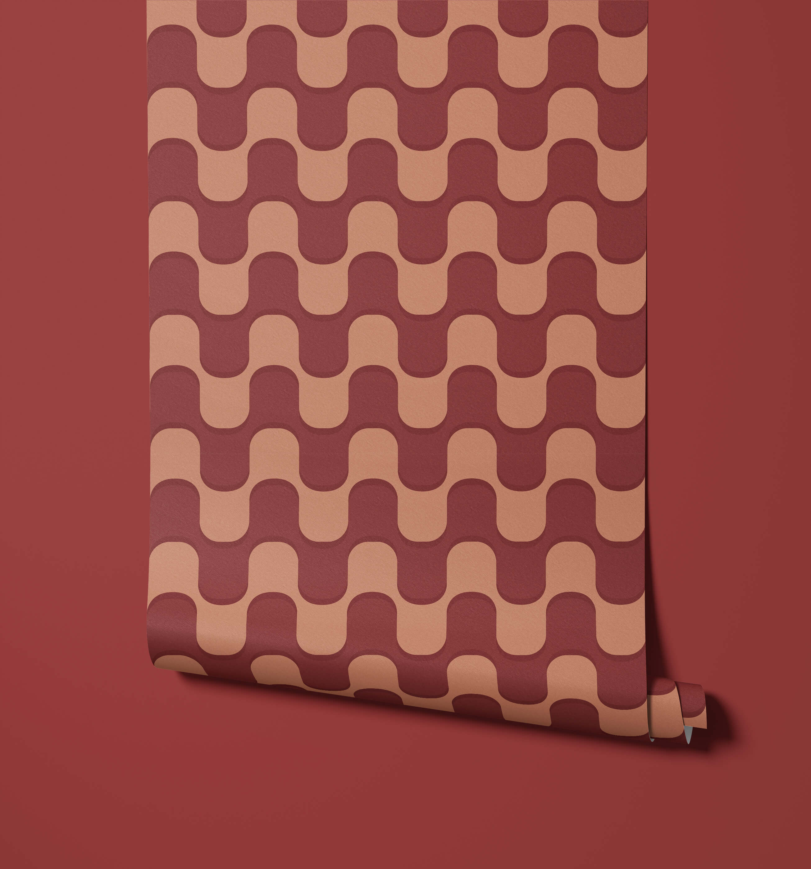 A roll of ballinger wallpaper with a repeating wavy pattern in muted terracotta and dusty rose tones
