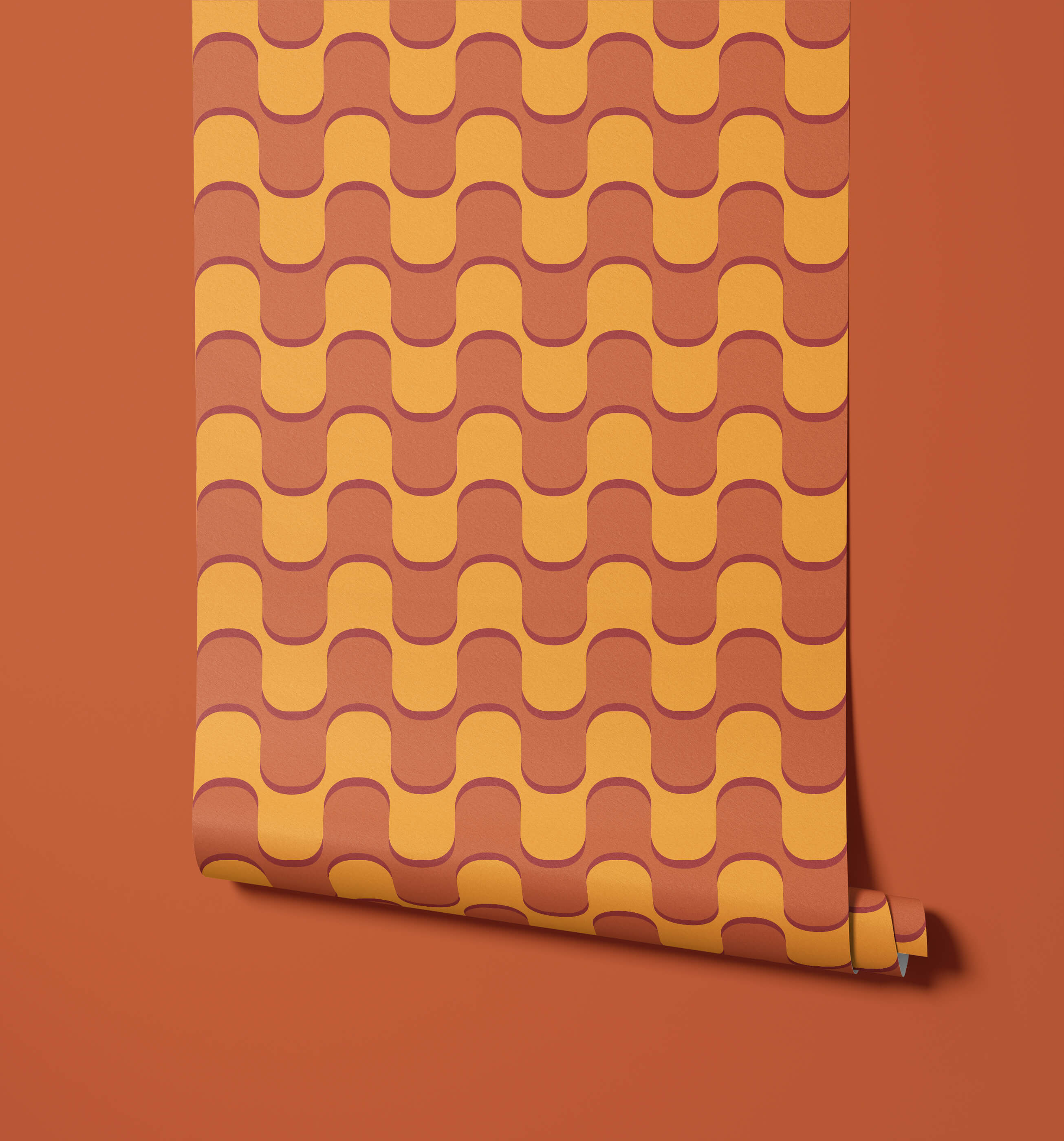 A roll of ballinger wallpaper with a retro wavy pattern in warm orange and mustard yellow tones