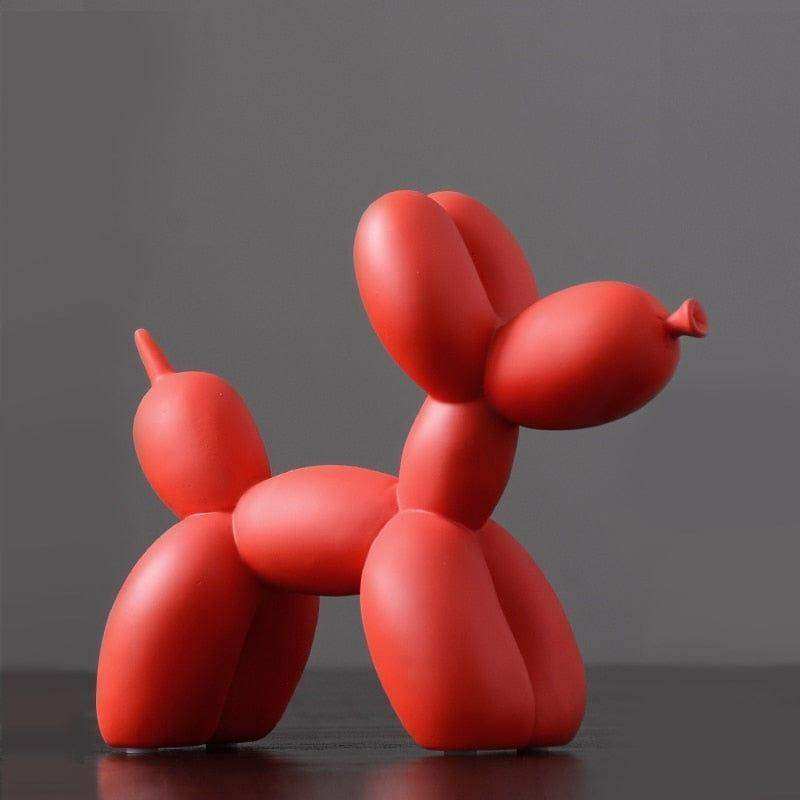 A vibrant red balloon dog sculpture made of pure resin with a smooth glossy finish and classic twisted design
