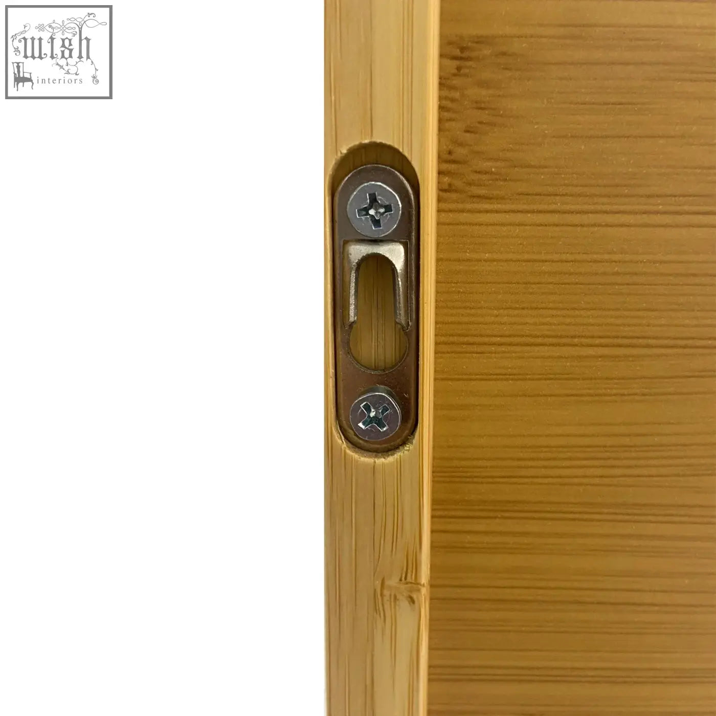 A sleek brushed metal door latch with matte finish on a solid wood bamboo wall cabinet for kitchen storage