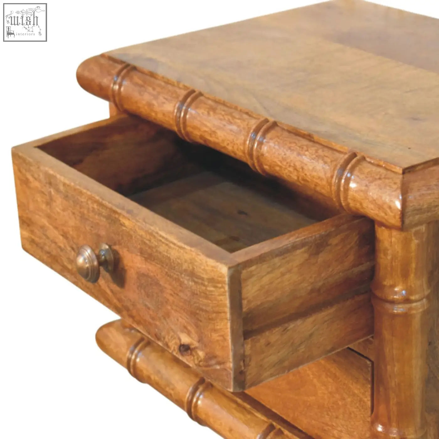 A rustic bamboo bedside nightstand in amber oak finish with a single drawer and brass knob for bedroom use