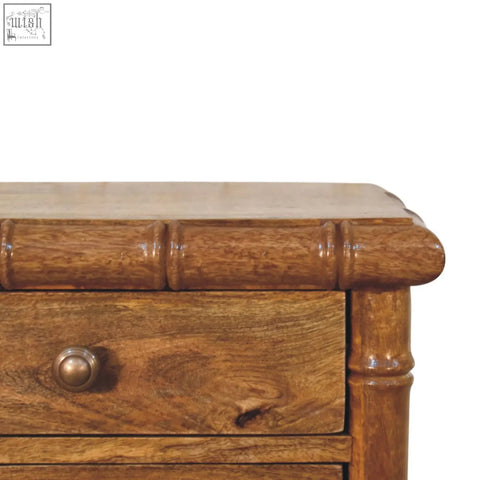 A rustic wooden bamboo bedside in amber oak finish with warm brown tones and natural wood grain texture