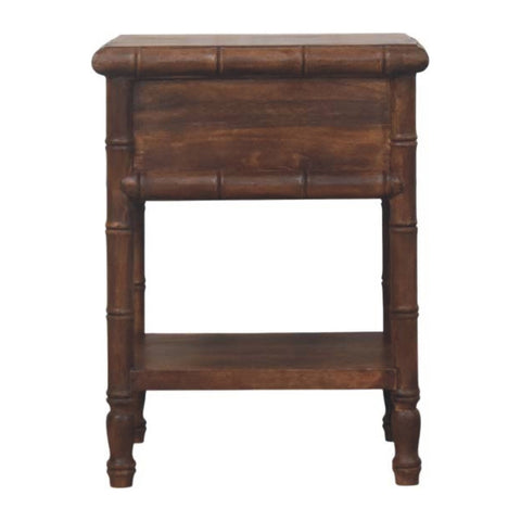 Dark brown bamboo carved bedside table with brass accents made of solid mango wood featuring a drawer and shelf