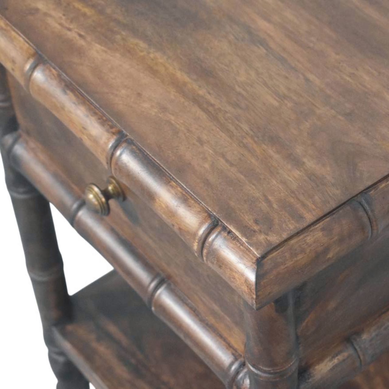 Dark brown bamboo carved bedside table with solid mango wood, brass knob, single drawer, and open shelf design