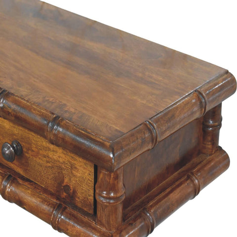 Rustic brown bamboo console table with a single drawer and dark metal knob for stylish storage and decor