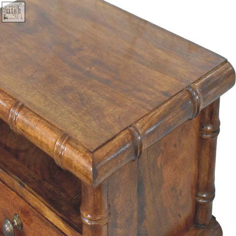 Rich brown wooden bamboo wall-mounted bedside nightstand with turned legs and polished grainy surface