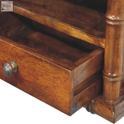 Bamboo wall-mounted bedside with a rich warm wooden drawer and polished brass knob for stylish storage