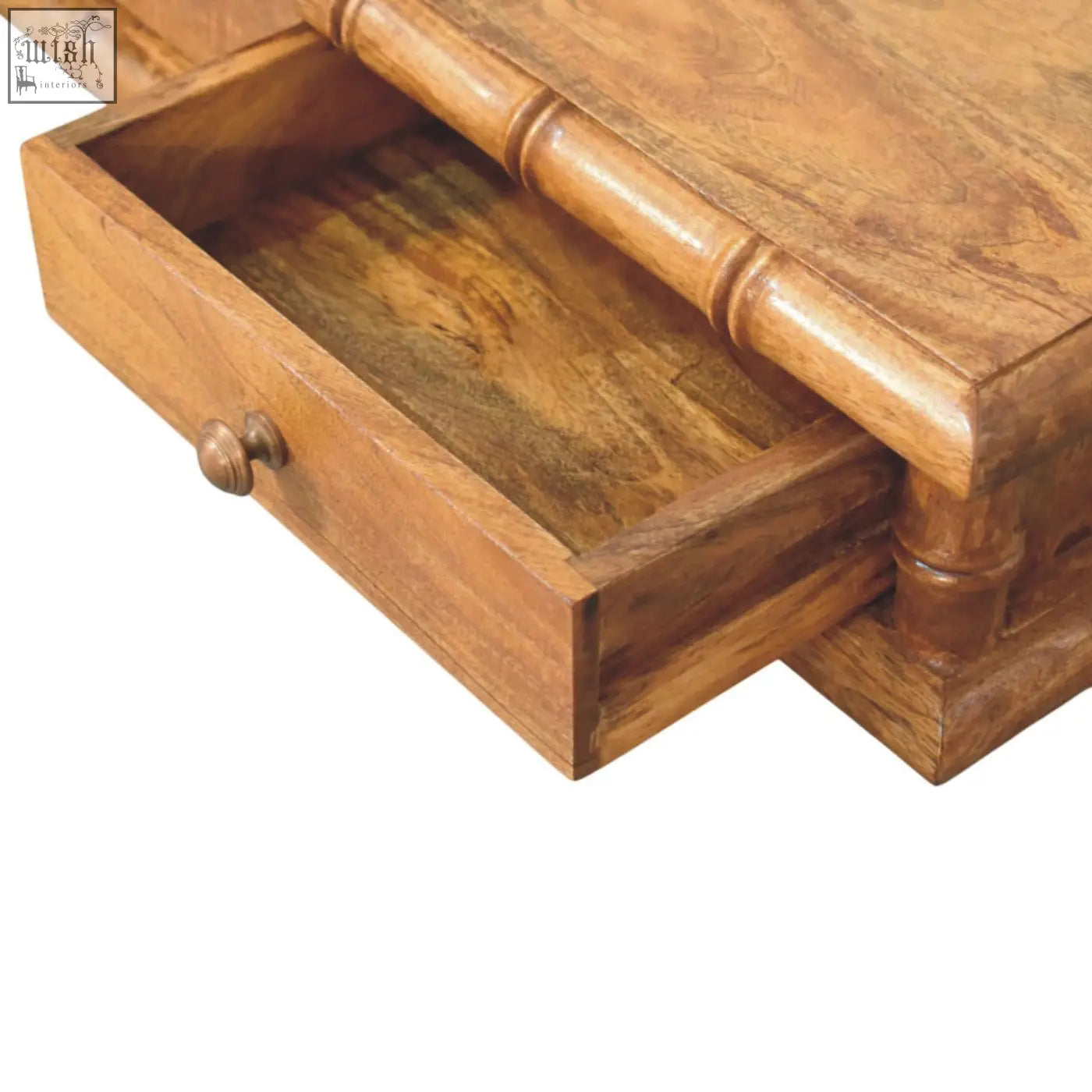 A warm medium-toned wooden desk drawer with bamboo style handle and round knob from bamboo wall-mounted console