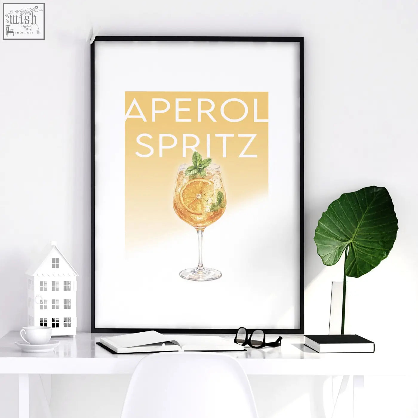Black-framed bar wall art decor featuring a golden aperol spritz cocktail illustration for living room display