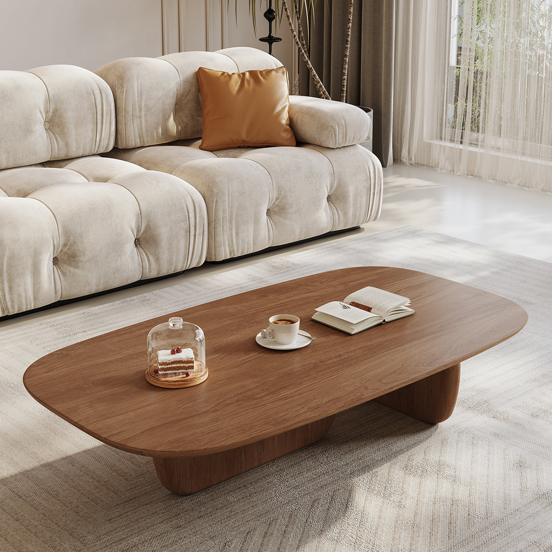 Modern wooden barakat travertine coffee table set with sleek oval top and sculpted walnut base perfect for living room