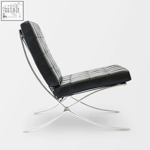 Black real leather barcelona chair with a sleek chrome x-shaped base perfect for stylish seating