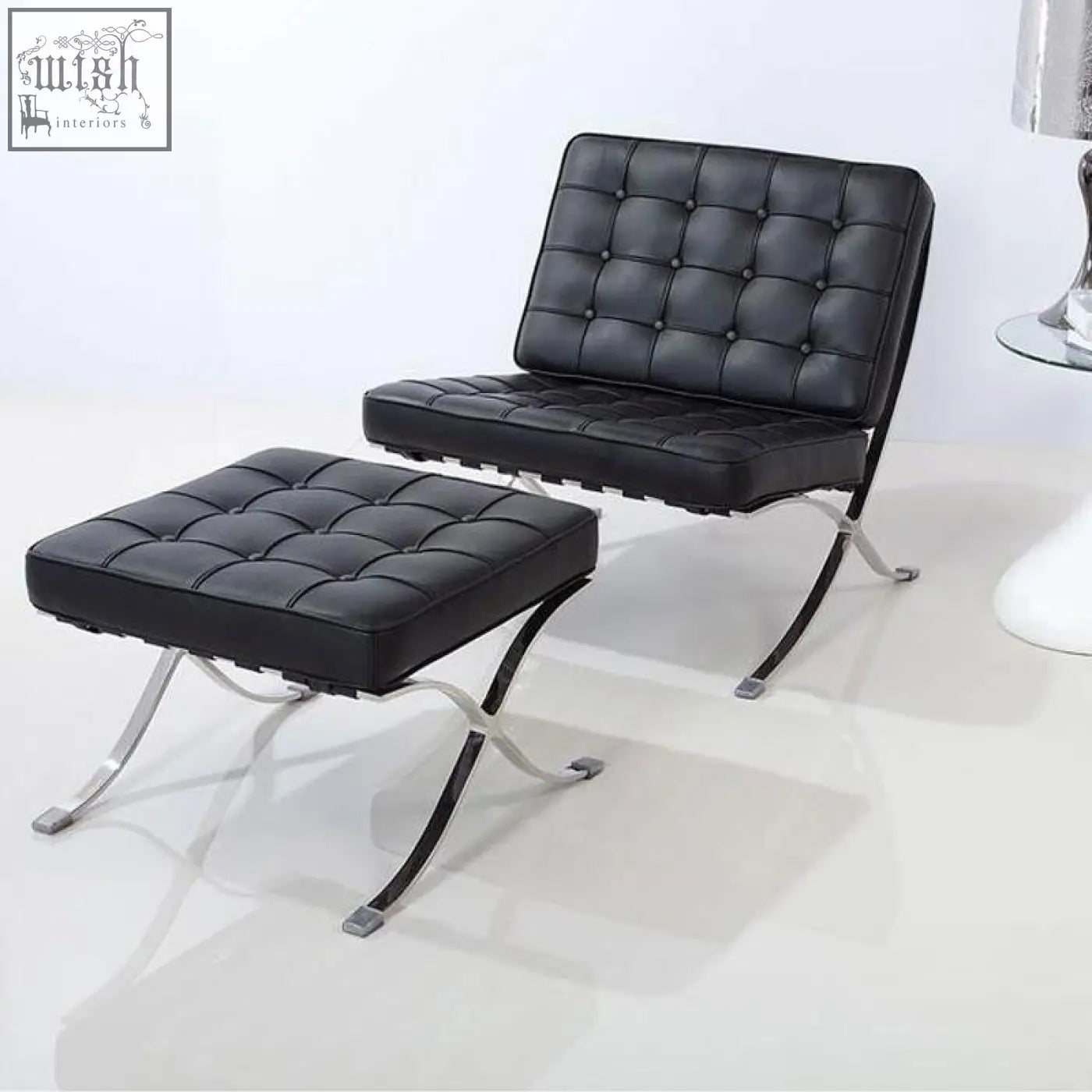 Black leather barcelona chair with tufted real leather cushions and painted steel x-frame legs for stylish seating