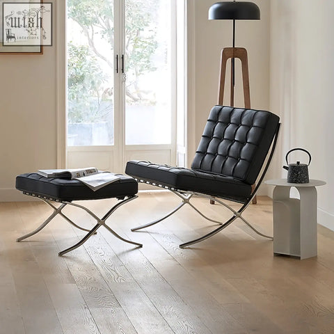 Black leather barcelona chair with real leather upholstery and painted steel chrome x-frame base for sleek seating