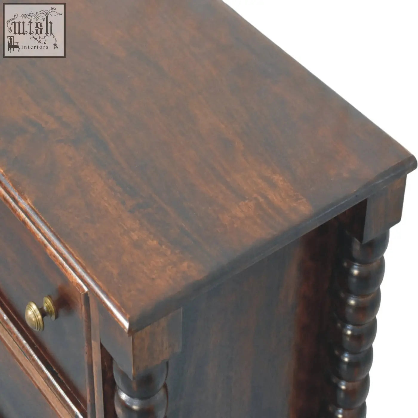 Dark brown wooden nightstand with polished finish and turned spindle legs in winewood oak tone with antique brass knobs