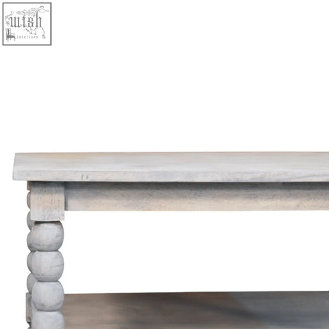 Rustic gray acid wash coffee table with distressed finish, turned bead legs, and a lower shelf for storage