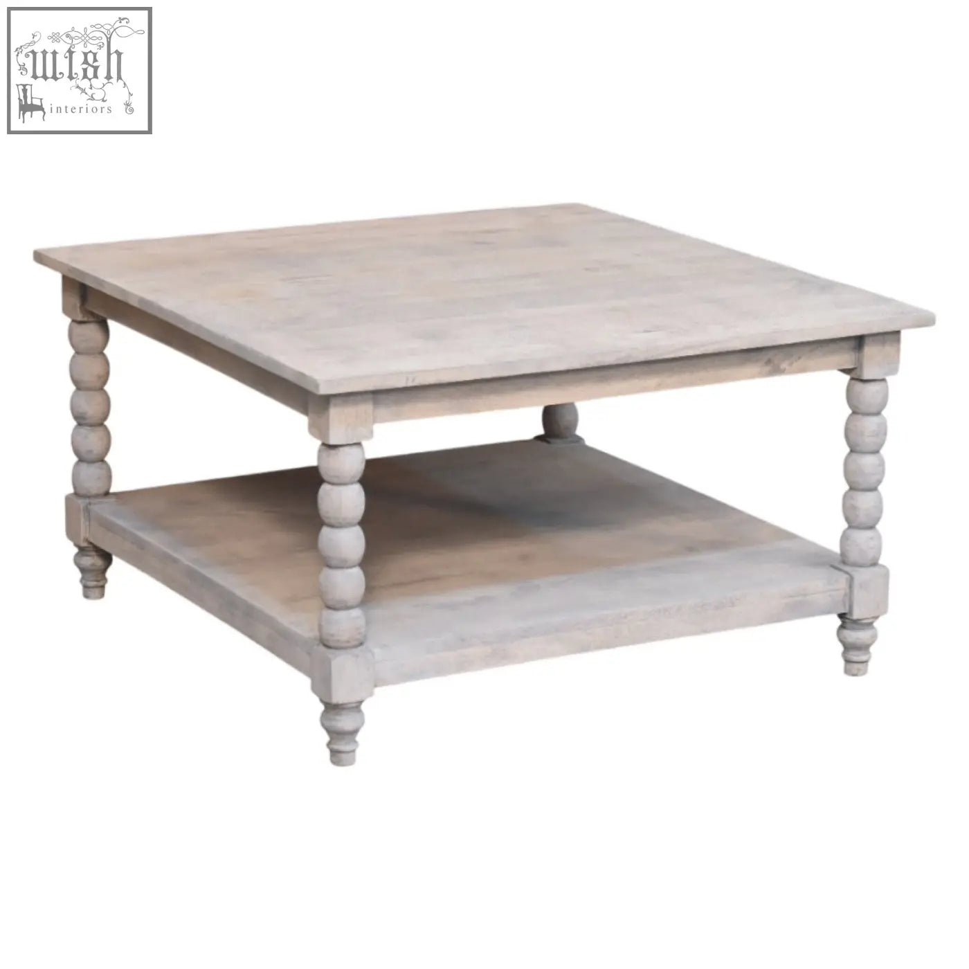 Barclay acid wash coffee table with distressed white finish, turned wooden legs, and open lower shelf for storage