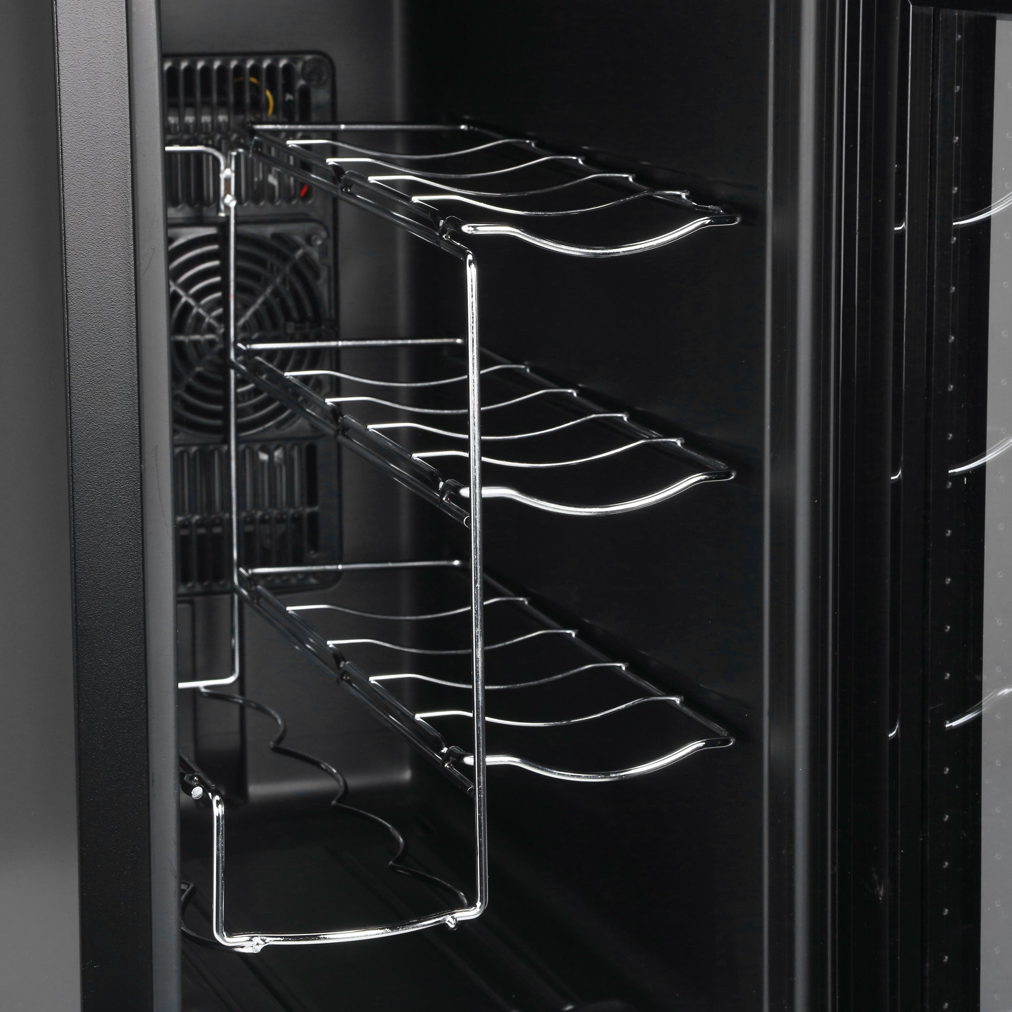 Chrome finished metal wine rack with curved wave shelves inside black barcool vino wine display fridge with led lighting
