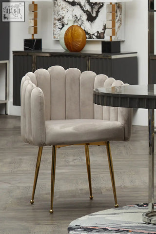Beige mink velvet scalloped dining chair with gold-tone metal legs and a stylish curved back design