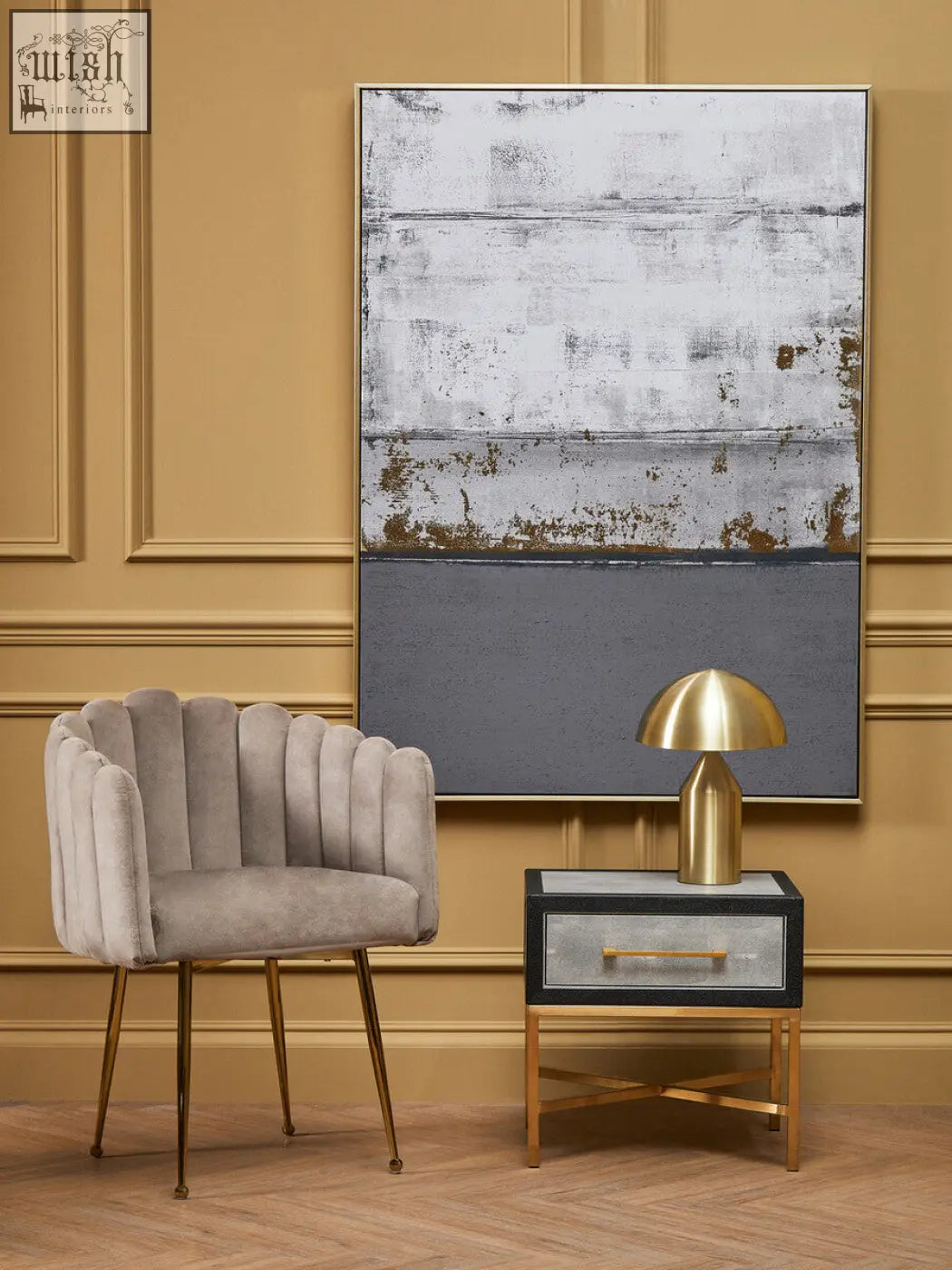 A sleek light gray mink velvet scalloped dining chair with gold tone legs perfect for stylish dining rooms