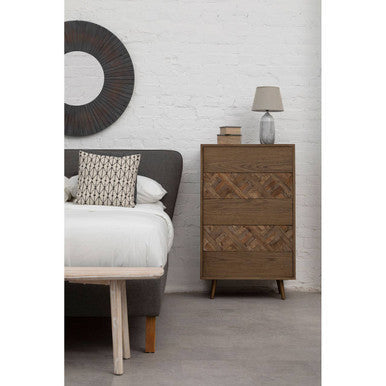 The wooden dresser with a warm barn antique wood finish features herringbone patterned drawers and sleek tapered legs