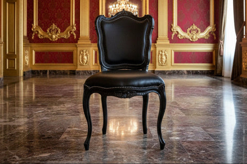 Black leather baroque dining chair with ornate gold trim and curved legs perfect for elegant dining setups