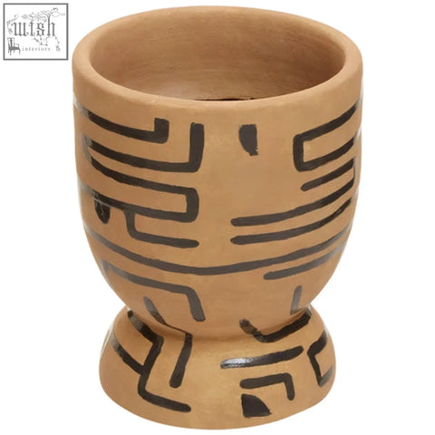 Terracotta hand painted earthenware planter with black geometric patterns in a ceramic egg cup shape