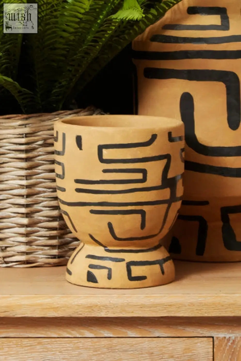 Tan ceramic barren hand painted earthenware planter with black geometric patterns and hand painted design