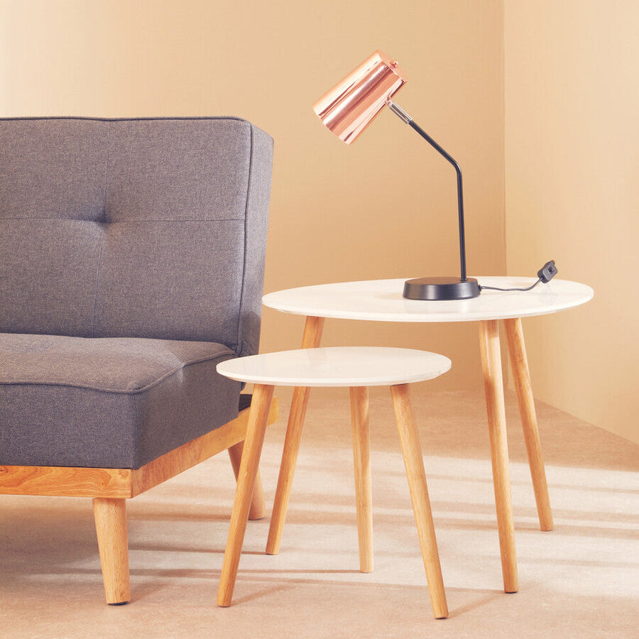 Bart copper desk lamp with sleek copper finish and black articulated arm on white circular table for desk use