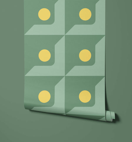 A roll of mint green wallpaper called Base with a geometric pattern and six bright yellow circular accents