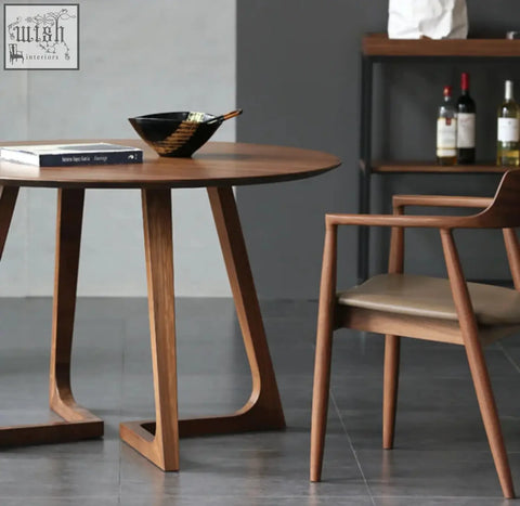 Modern wooden bashira dining table with sleek tapered legs and smooth warm-toned finish for stylish dining
