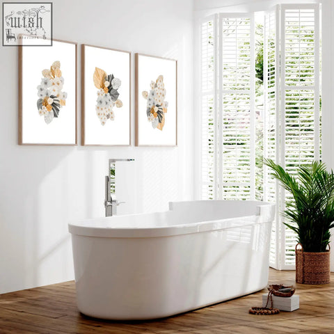 White freestanding bathtub with chrome faucet next to shabby chic bathroom decorations wall art set of 3