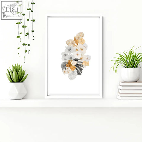 A set of 3 shabby chic bathroom decorations featuring framed wall art with delicate white gold and gray flowers and textured leaves