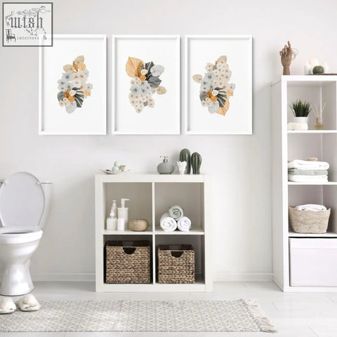 Three framed shabby chic botanical prints in soft white beige and gray tones perfect for bathroom decorations wall art