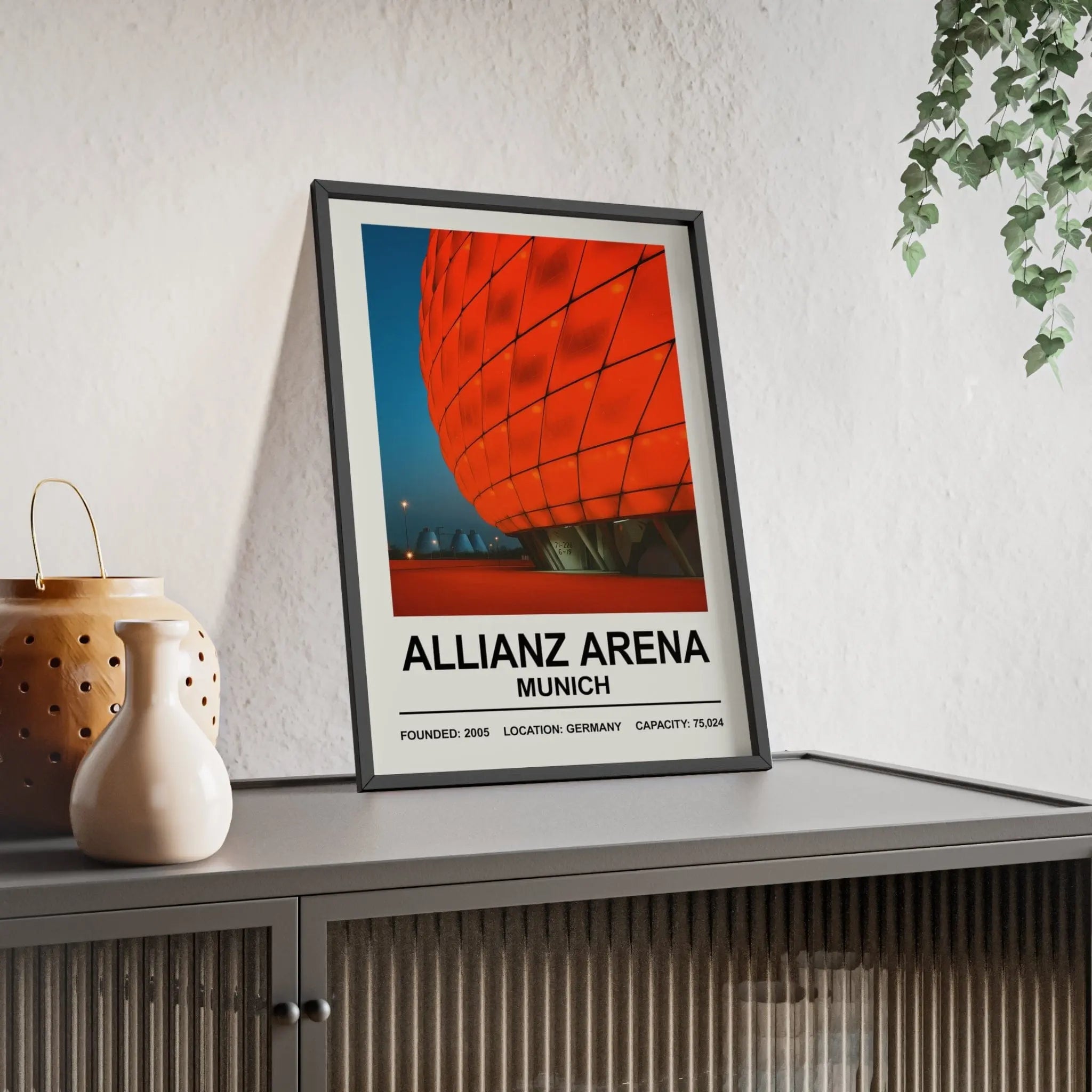 Black-framed bayern munich allianz arena stadium print with vibrant red and blue design plus white founding details